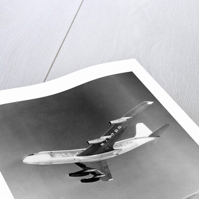 Large Aircraft Flying over Mountainous Region by Anonymous
