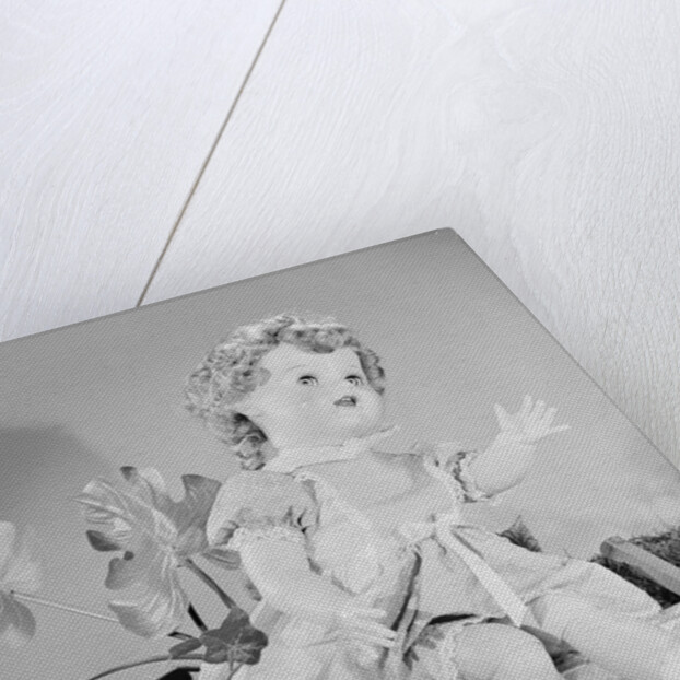 A Doll Sitting on a Wall by Anonymous