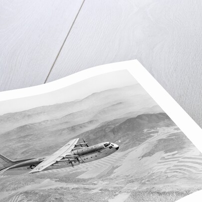 Airplane Flying Over Landscape by Anonymous