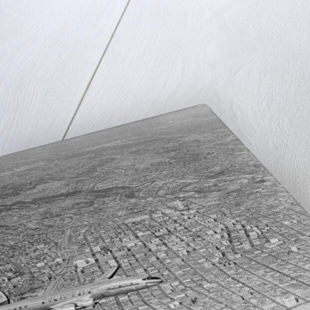 Airplane Flying Over Los Angeles by Anonymous