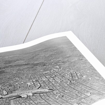 Airplane Flying Over Los Angeles by Anonymous