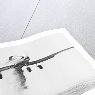 Crop Dusting Airplane in Flight by Anonymous
