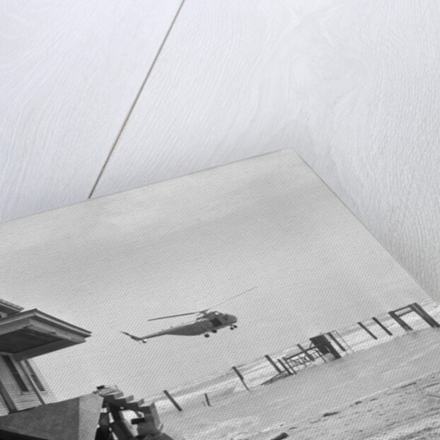 Helicopter Flying Over Storm Ridden Area by Anonymous