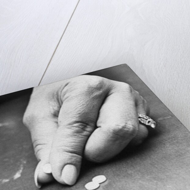 Hand Holding Pills Containing Thalidomide by Anonymous