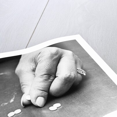 Hand Holding Pills Containing Thalidomide by Anonymous