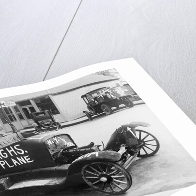 Early Model Car Parked at Station by Anonymous