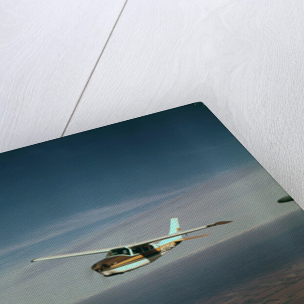 Cessna 210 Centurion Flying by Anonymous