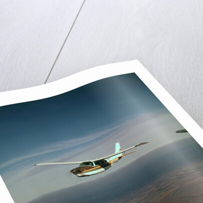 Cessna 210 Centurion Flying by Anonymous