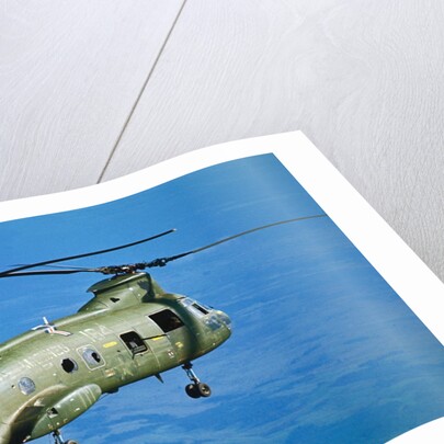 Military Helicopter Flying in Blue Skies by Anonymous