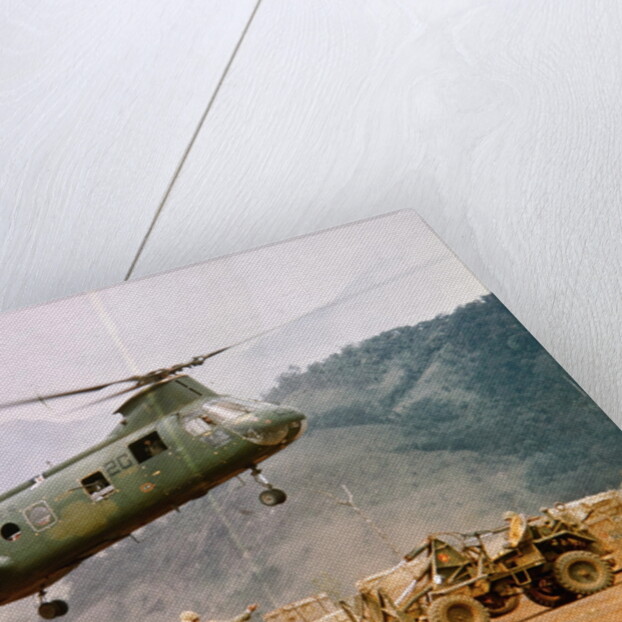 CH-46 Helicopter Picking up Supplies by Anonymous