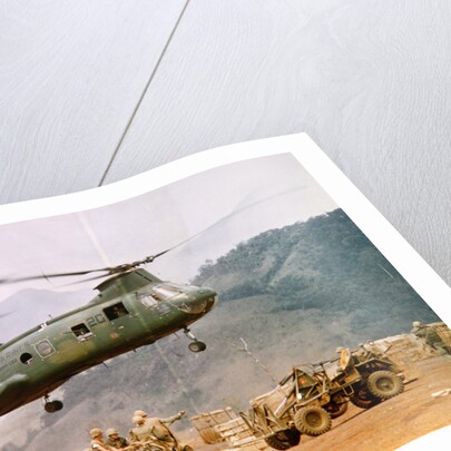 CH-46 Helicopter Picking up Supplies by Anonymous