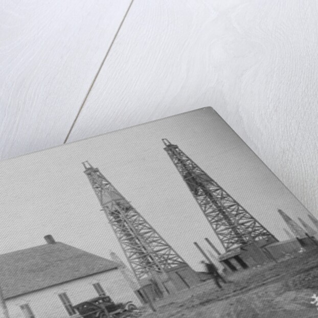 Oil Well Construction Behind Church by Anonymous