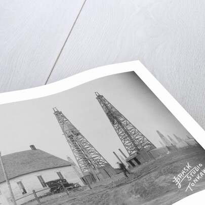 Oil Well Construction Behind Church by Anonymous