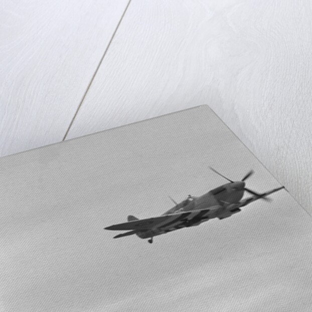 Airplane Flying Over Race Car in Action by Anonymous