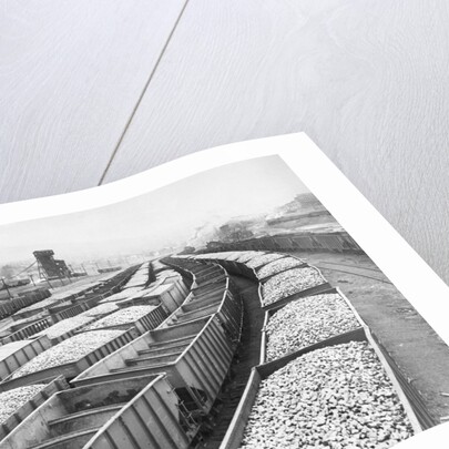 Train Cars Holding Coal Supplies by Anonymous