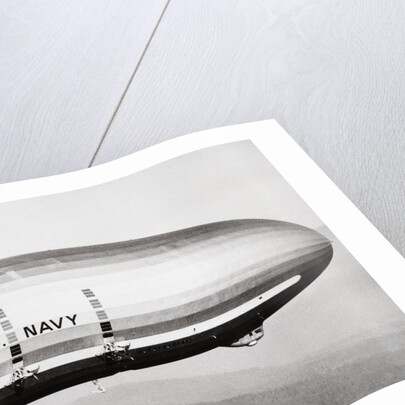 Plane Underneath Huge Dirigible in Flight by Anonymous