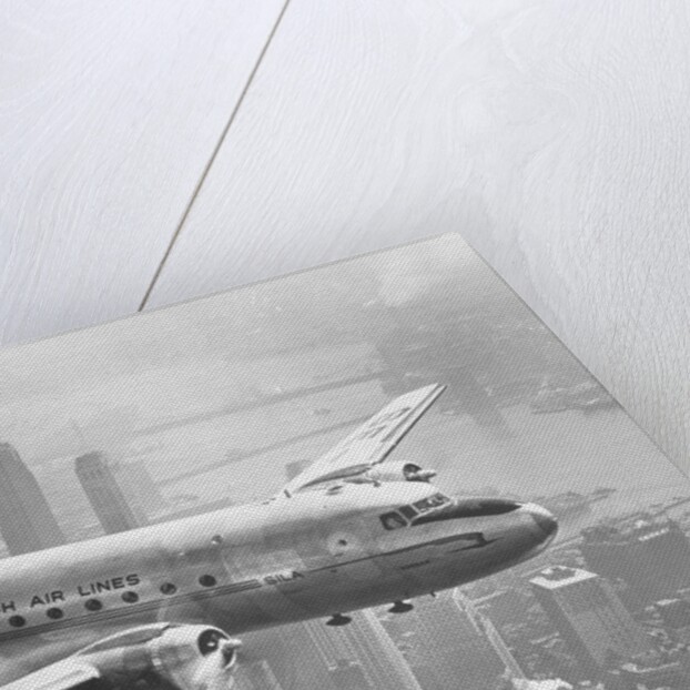 Aircraft Flying over City by Anonymous