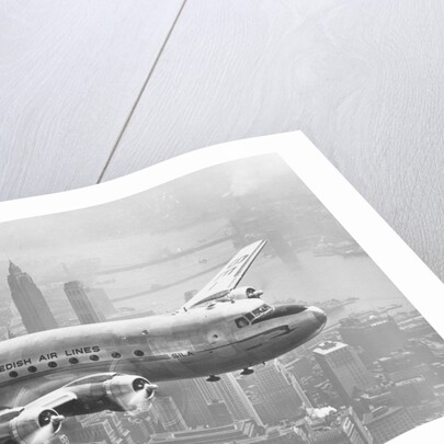 Aircraft Flying over City by Anonymous