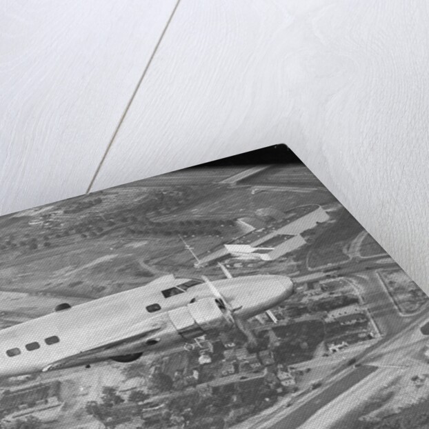 Howard Hughes Lockheed 14 Super Electra over Worlds Fair Site by Anonymous
