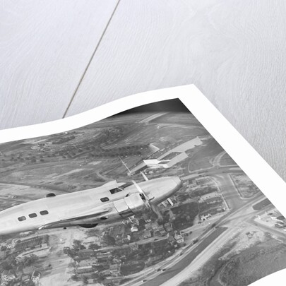Howard Hughes Lockheed 14 Super Electra over Worlds Fair Site by Anonymous