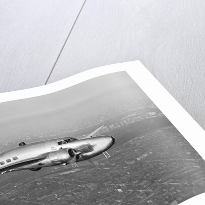 Howard Hughes' Lockheed 14 Super Electra over New York City by Anonymous