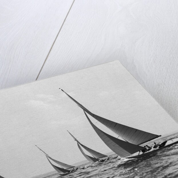 Six Meter Sailboats Leaning in Race by Anonymous
