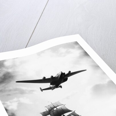 Airplane Flying over Ship by Corbis