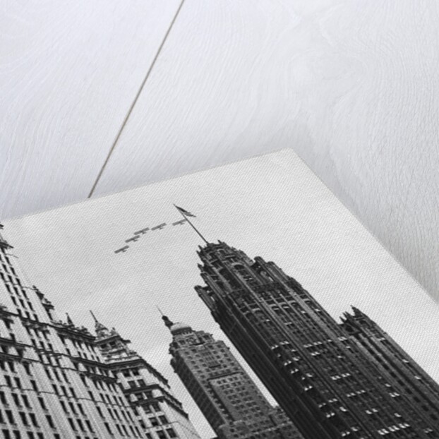 Planes Fly Over Buildings in Chicago by Anonymous