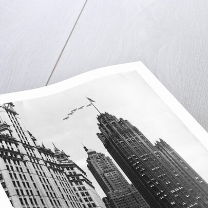 Planes Fly Over Buildings in Chicago by Anonymous