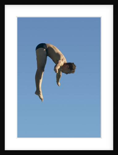 Profile shot of a young man diving by Anonymous