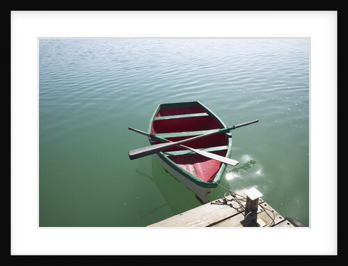 Rowing boat moored at the end of a jetty by Anonymous