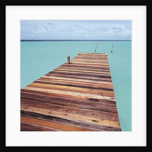 Wooden jetty leading out to sea by Anonymous