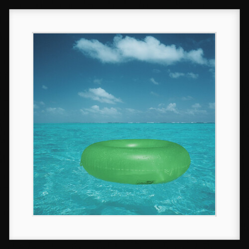Inflatable rubber ring floating in the sea by Anonymous