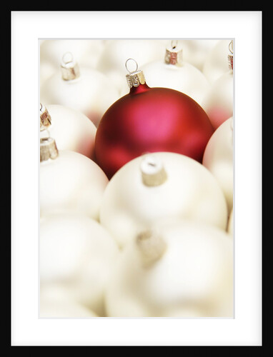 White Christmas tree decorations and a red one by Anonymous