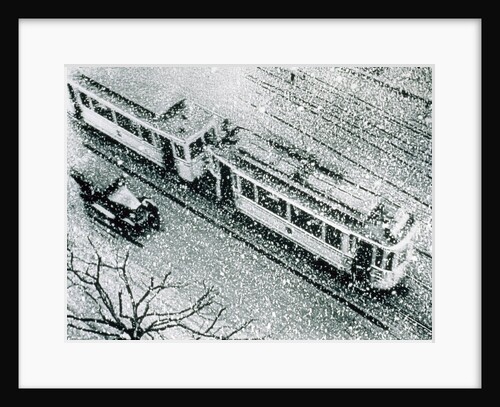 Urban traffic during snowfall, historic photo by Anonymous