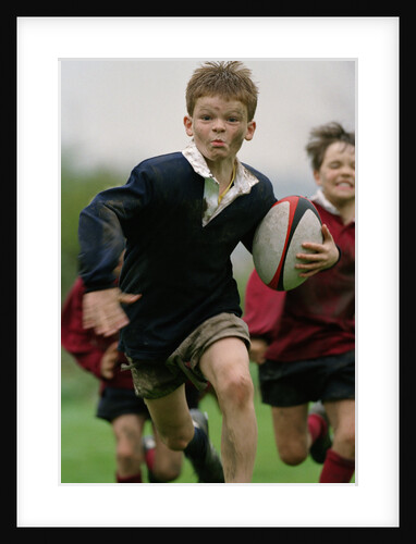 Boy Running with Rugby Ball by Anonymous