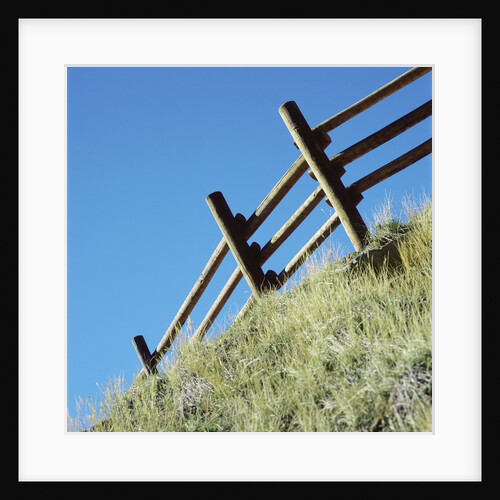Low angle view of rustic wooden fence by Anonymous