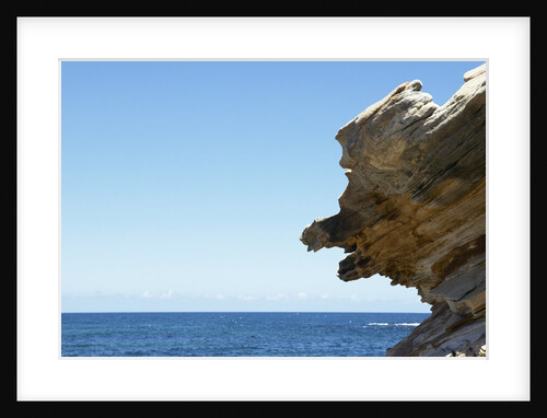Detail view of rocks jutting out into the ocean by Anonymous