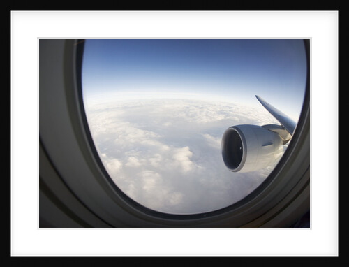 Airplane Window Looking Out on Cloudy Sky by Anonymous