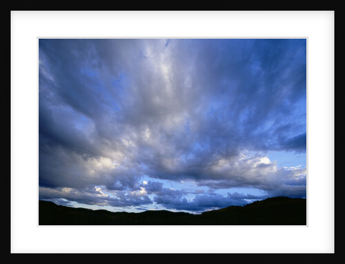 Cumulus Clouds over Mountain Range by Anonymous