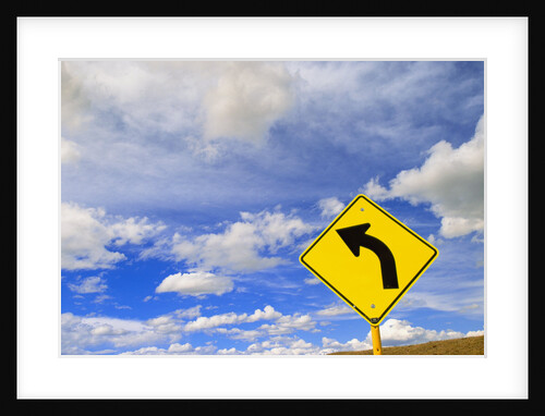 Curve Road Sign on Highway Against Sky by Anonymous