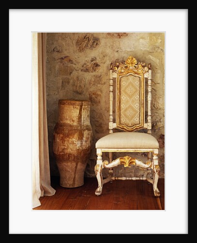 A pot is kept beside a chair against the wall in the house by Anonymous