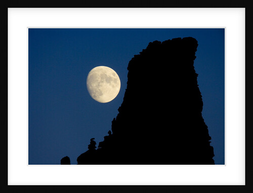 Full Moon Beside Rock by Anonymous