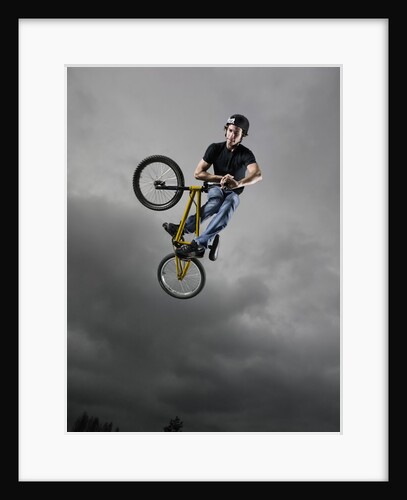 BMX Biker Performing Tricks by Anonymous