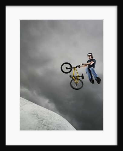 BMX Biker Performing Tricks by Anonymous
