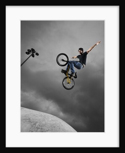 BMX Biker Performing Tricks by Anonymous
