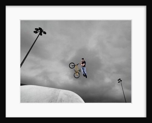 BMX Biker Performing Tricks by Anonymous