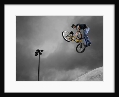 BMX Biker Performing Tricks by Anonymous