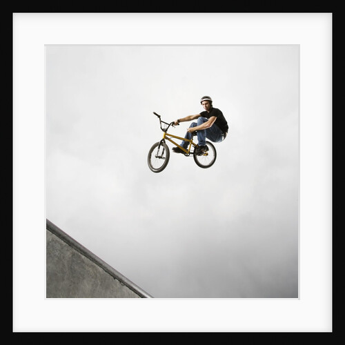 BMX Biker Performing Tricks by Anonymous