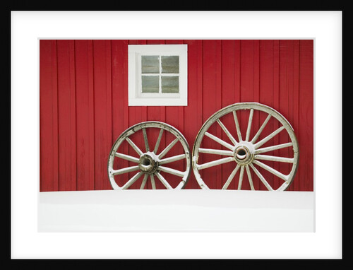 Wagon Wheels on Snow Against Stable by Anonymous